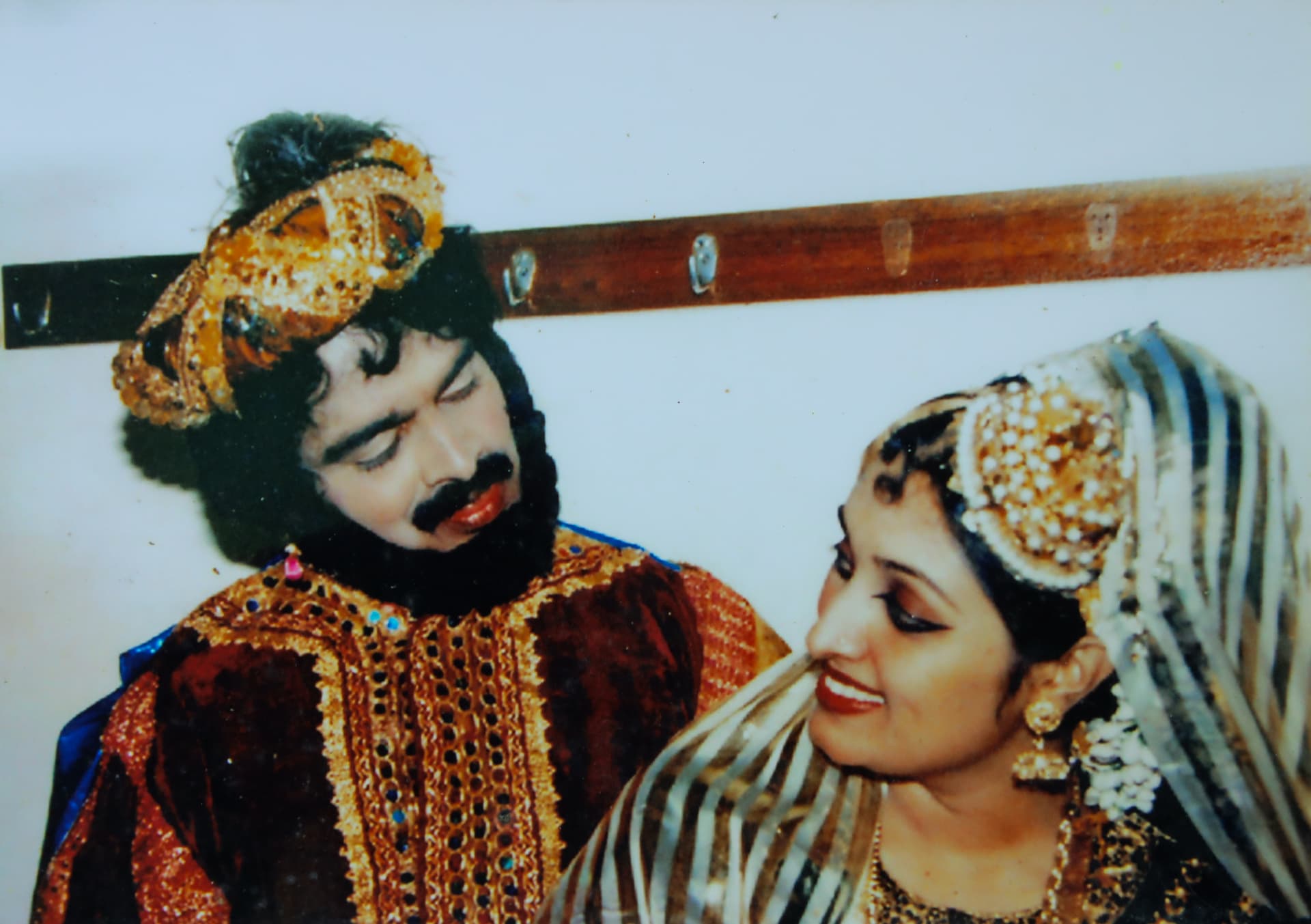 Two performers in ornate dance-drama costume