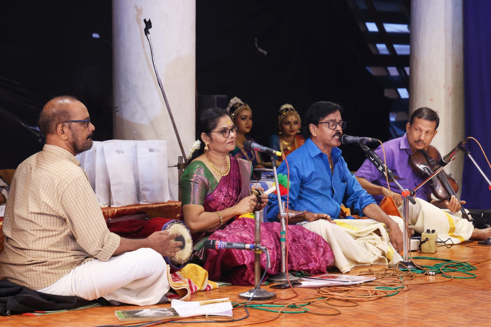 Guru V. S. Janardhanan singing for a dance recital with mridangam, violin and supporting artists