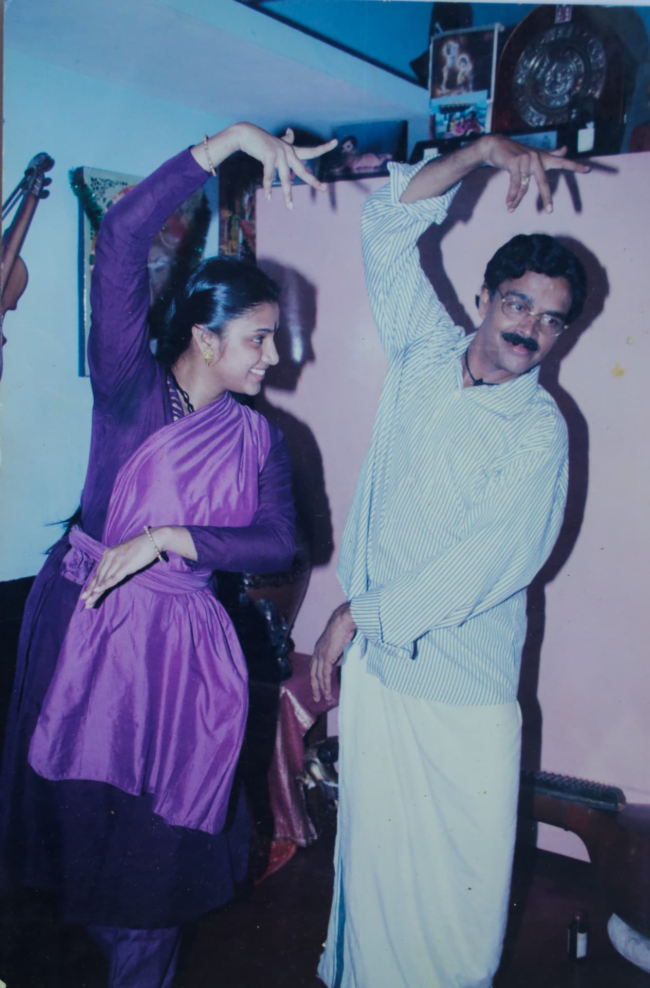Sri V. S. Janardhanan demonstrating dance poses with Samyuktha Varma
